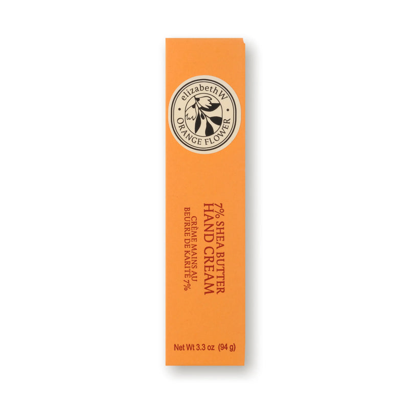 A rectangular orange box of elizabeth W Orange Flower Hand Cream, 3.3 oz, features white and brown branding—an indulgent hand cream for nourished skin.
