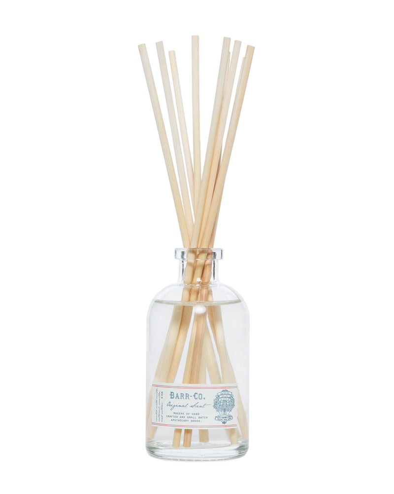 A Barr-Co. Original Scent Diffuser Kit with several light brown reed sticks, labeled "barr-co. apothecary" with marine life illustrations, isolated on a white background.