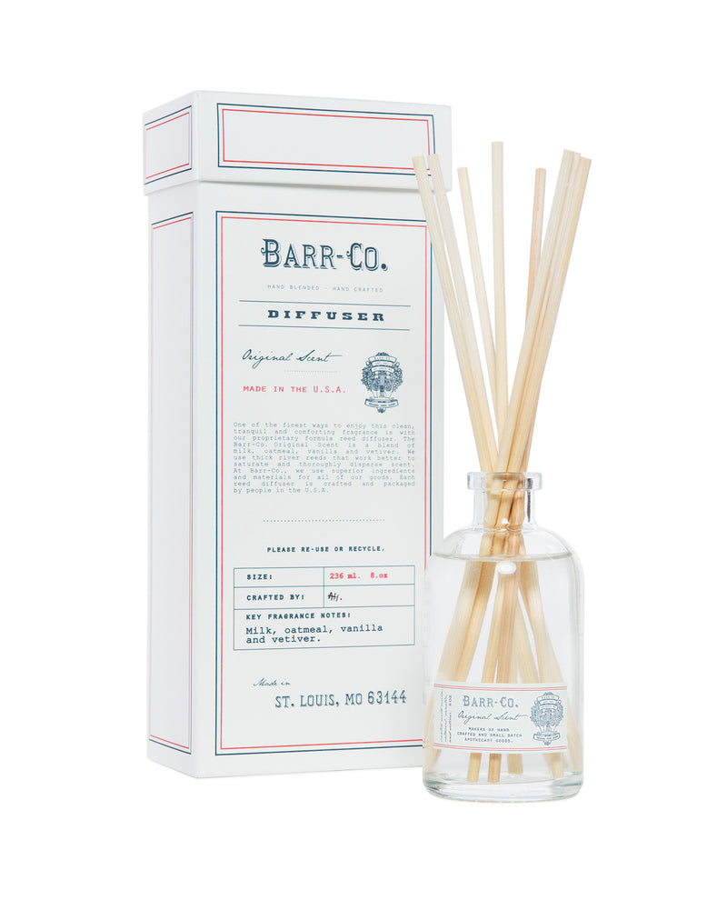 A Barr-Co. Original Scent Diffuser Kit with several sticks and a clear glass bottle, standing next to its white and red packaging box labeled "Barr-Co. Original Tranquil Scent Diffuser Kit.
