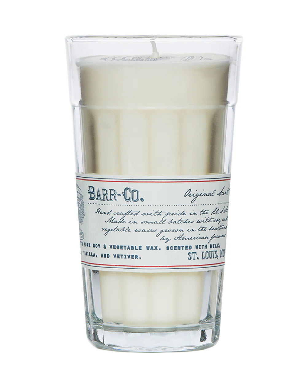 The Barr-Co. Original Scent Parfait Candle is a white soy candle in a tall clear glass with a vintage label, handcrafted for long-lasting burn and features vanilla, oatmeal, and vetiver notes.