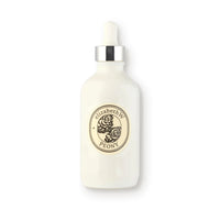 A white bottle with a dropper top, adorned with a cream and black label that displays "elizabeth W Botanist's Scent Lab Peony Body Oil" along with a floral emblem. This Peony Body Oil bottle is ideal for skin hydration and features a silver accent near the dropper.