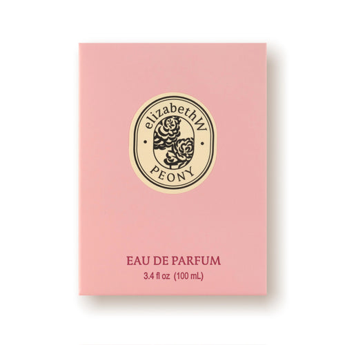 A rectangular pink perfume box features "elizabeth W Botanist's Scent Lab Peony Eau de Parfum" in a decorative font and floral design on the front, capturing the essence of a botanist's scent lab. Below, the text reads "EAU DE PARFUM" and "3.4 fl oz (100 mL)" in red lettering, highlighting this exquisite floral fragrance.