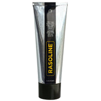 The Molinard Rasoline Shaving Cream comes in a metallic silver tube with "RASOLINE" in bold yellow on a black stripe, "Molinard" at the bottom, and a black screw cap.