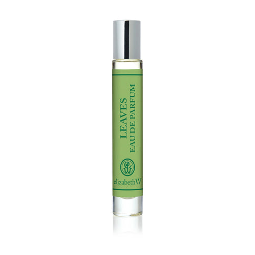 The elizabeth W Botanist's Scent Lab Leaves Rollerball features a glass bottle with a silver cap and green label reading "LEAVES EAU DE PARFUM" and "elizabethW," plus a logo near the bottom.