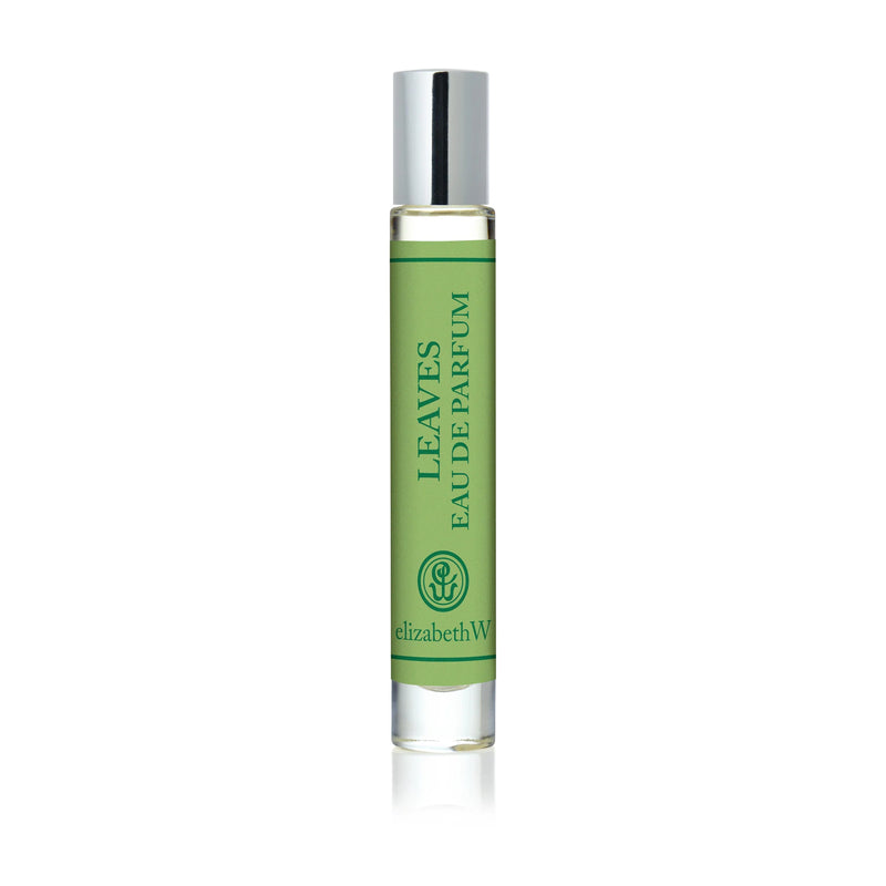 The elizabeth W Botanist's Scent Lab Leaves Rollerball features a glass bottle with a silver cap and green label reading "LEAVES EAU DE PARFUM" and "elizabethW," plus a logo near the bottom.