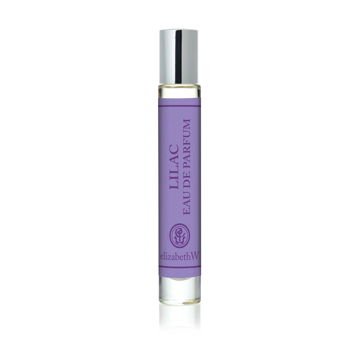 The elizabeth W Botanist's Scent Lab Lilac Rollerball features a clear glass bottle with a silver cap and contains a light purple floral fragrance inspired by botanist scents.