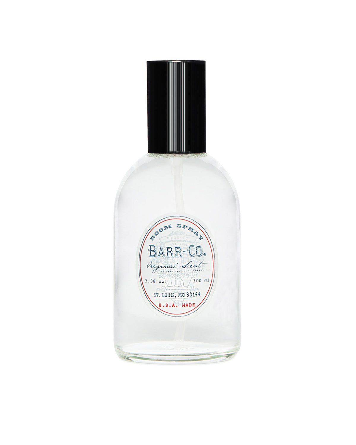 A 3.4 oz (100 ml) Barr-Co. Original Scent Room Spray comes in a clear glass bottle with a black cap and a vintage-style label, highlighting its sophisticated signature aroma with notes of milk, oatmeal, and vanilla—a true reflection of its American craftsmanship and fragrance development heritage.