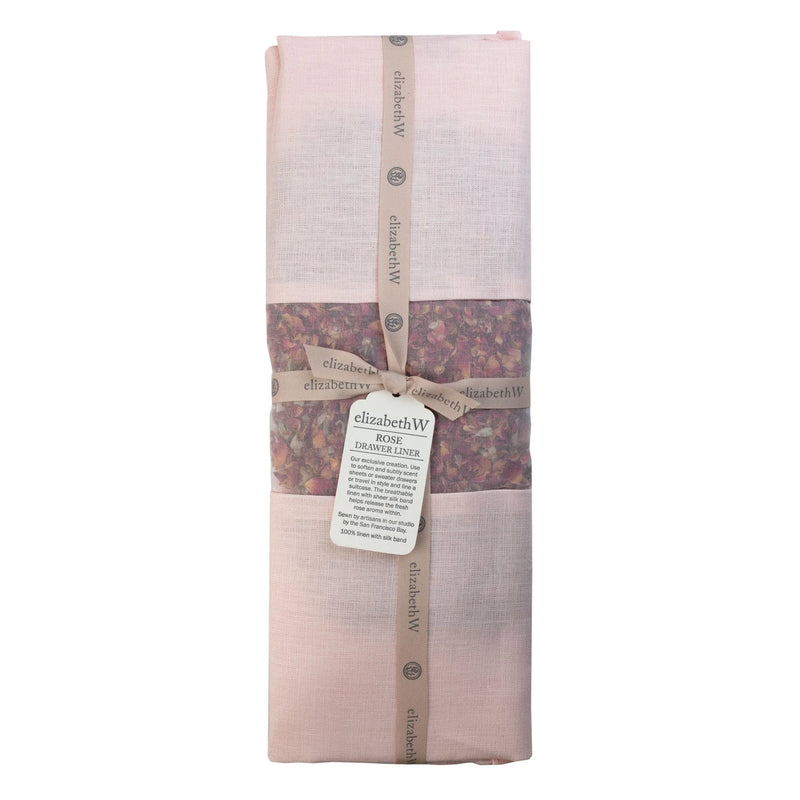 The elizabeth W Rose Drawer Liner Pink Linen comes neatly folded, tied with a branded ribbon, and features a window showing rose petals inside—a lovely way to add fragrance and elegance to your drawers.