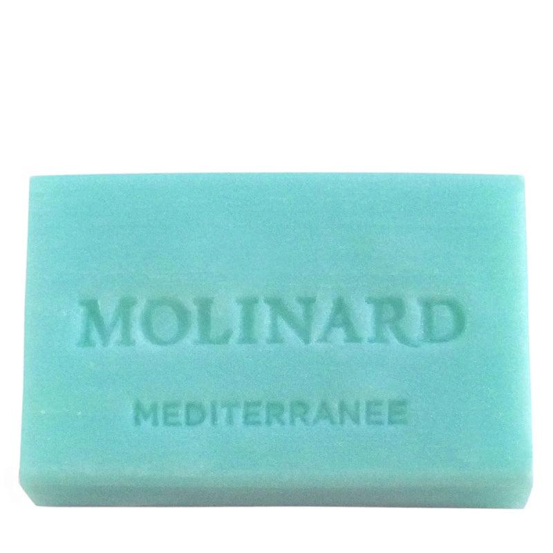 Molinard Soap - Méditerranée by Molinard is a turquoise rectangular bar, embossed with "Molinard" and "Méditerranée," offering a refreshing Mediterranean scent.