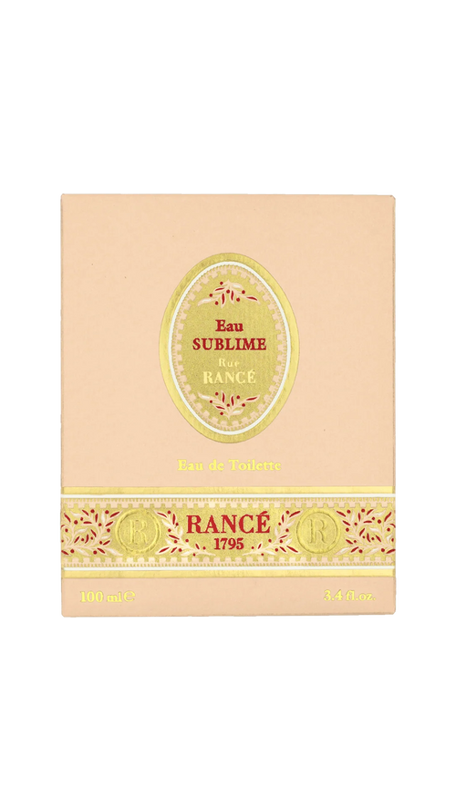 A beige box of Rancé Sublime Eau de Parfum by Rancé, adorned with gold and red accents and “Eau de Parfum” plus “100 mL / 3.4 fl. oz.” at the bottom—a luxurious floral fragrance.