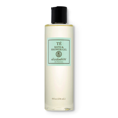 A clear plastic bottle with a black cap holds elizabeth W Signature Té Bath & Shower Gel, infused with Amalfi lemons and oriental black teas. The light green label displays the brand, product name, and size: 8 fl oz (236 mL).