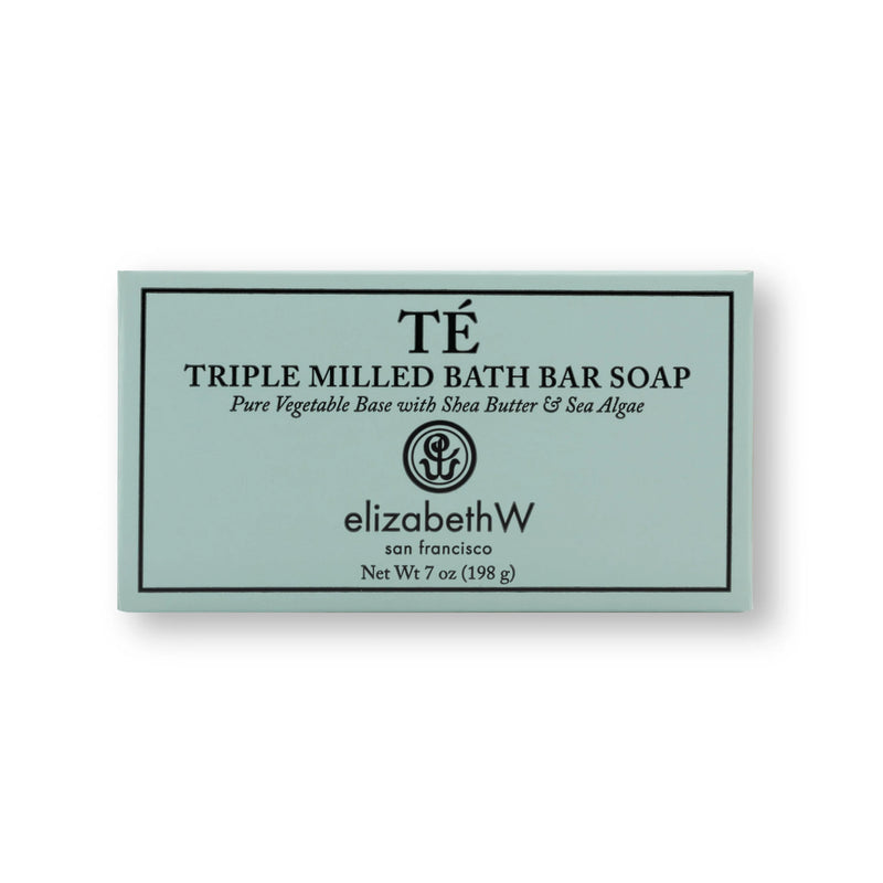 A rectangular bath bar soap packaging labeled "elizabeth W Signature Té Soap Bath Bar" by Elizabeth W, highlighting ingredients like shea butter & sea algae, set against a soft green background.