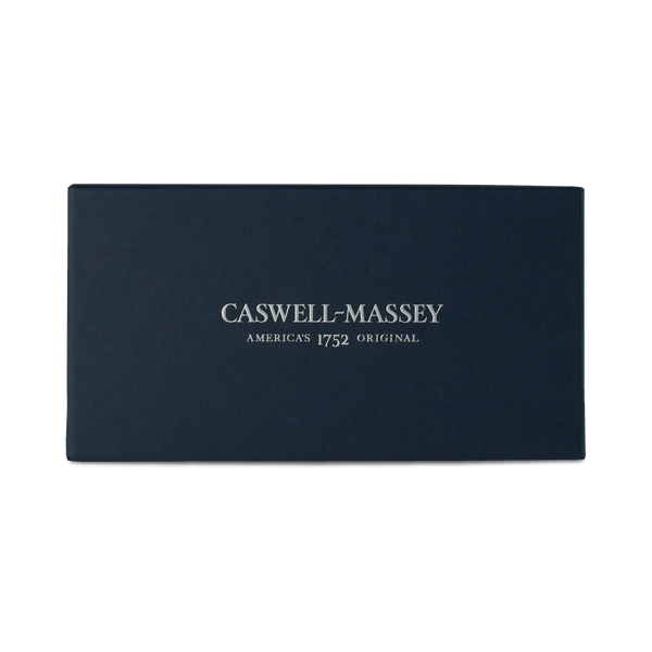 A rectangular, dark blue Caswell-Massey box labeled "Caswell-Massey Oval Soap Bundle" sits against a plain white background, with the brand's name and "America's 1752 Original" printed in white on the lid.