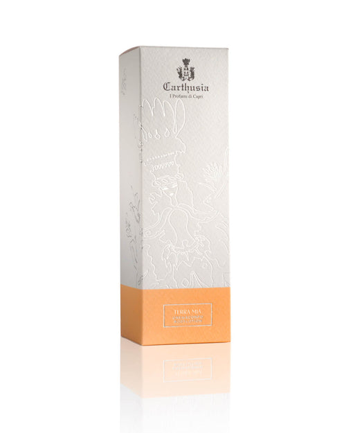 The Carthusia Terra Mia Body Lotion by Carthusia I Profumi di Capri pairs perfectly with the tall, rectangular Terra Mia Eau de Parfum box, featuring a white embossed top and orange lower section.