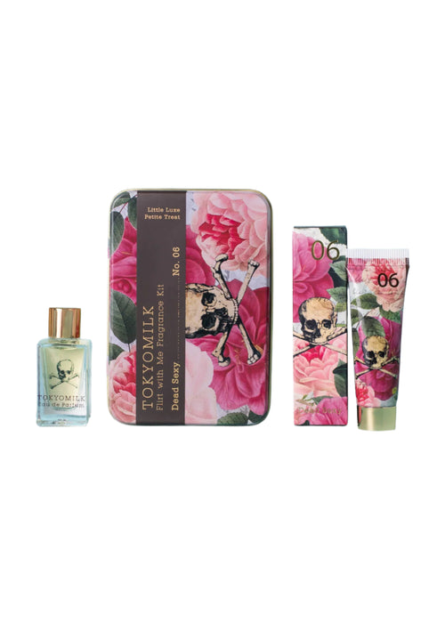 Explore the TokyoMilk Dead Sexy Flirt With Me Kit by Margot Elena, featuring a small perfume with enchanting notes in a floral skull metal case, plus matching lip balm and hand cream tubes labeled "No. 06" and "Tokyo Milk, Dark Sassy.