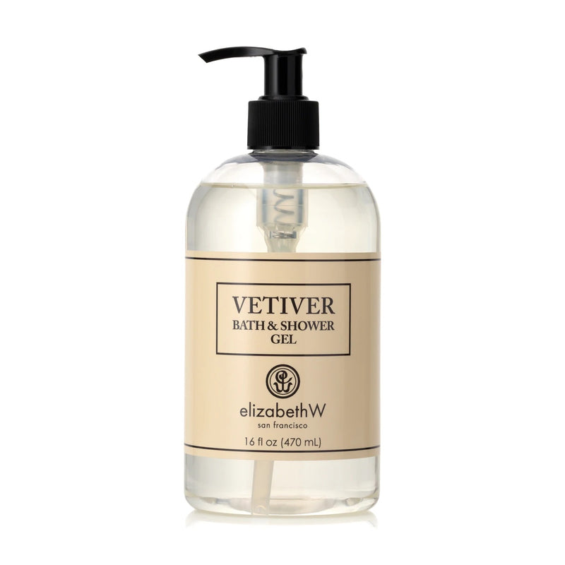 A clear bottle of elizabeth W Vetiver Bath & Shower Gel - 16oz with a black pump dispenser. The label is in white and brown, highlighting the brand.