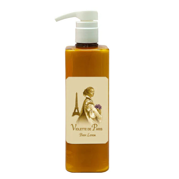 The La Bouquetiere Violette de Paris Body Lotion comes in a rectangular amber pump bottle with a label featuring a woman holding violets and the Eiffel Tower, emphasizing youthful elasticity with nourishing active aloe.