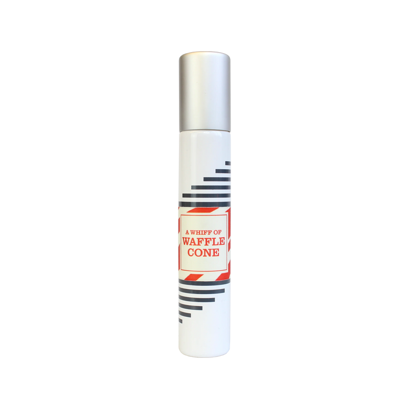 A tall, cylindrical perfume bottle with a white base and a silver cap. It features a red and white label reading "Imaginary Authors A Whiff of Wafflecone - Travel Size" by Imaginary Authors and black diagonal stripes on the sides.