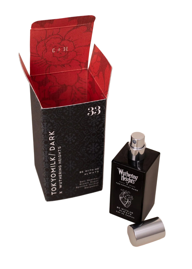 Perfume bottle with red and black packaging on a white background
