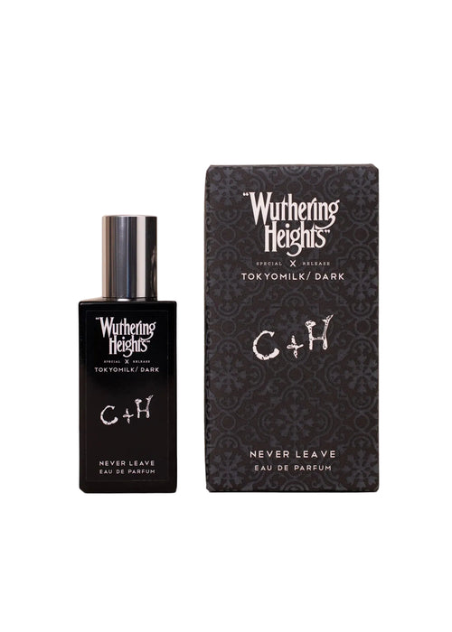 A black bottle of Margot Elena's TokyoMilk Dark "WUTHERING HEIGHTS" Never Leave Eau de Parfum sits beside its box, highlighting the fragrance’s mysterious, botanical allure.