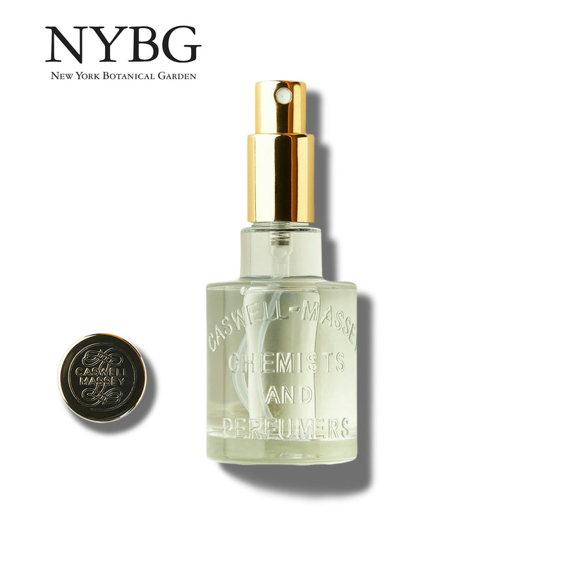 A clear glass perfume bottle with a golden spray nozzle and black cap, labeled "Caswell Massey," featuring fresh floral scents of Caswell - Massey Gardenia Gardenia | 50ml EDT, on a white background with the brand name.