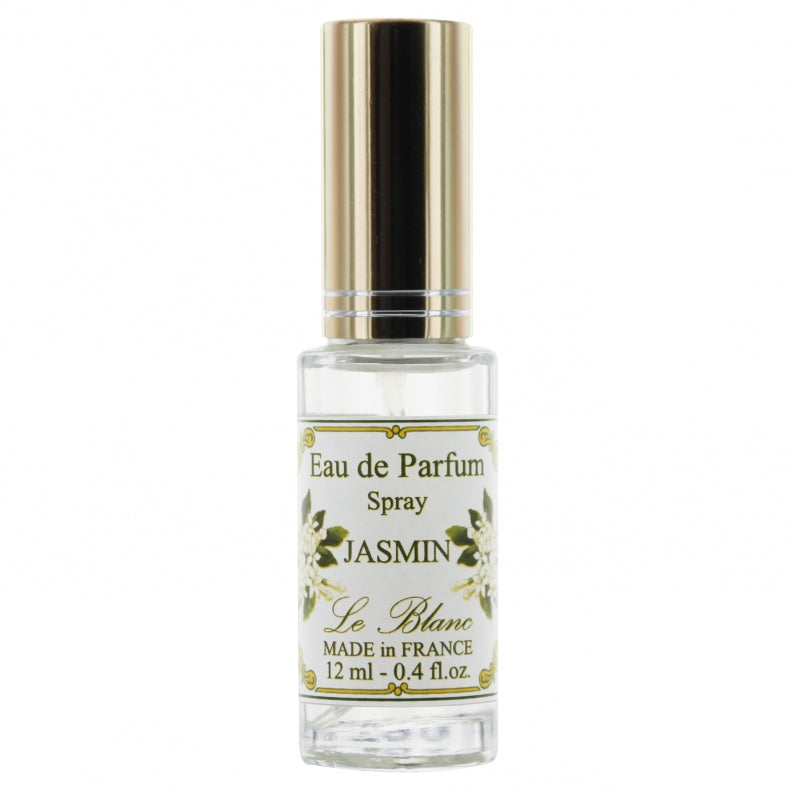 A clear glass bottle of Le Blanc Jasmin perfume with a gold cap, labeled "jasmin le blanc," containing 12 ml of fragrance, showcased against a white background.
