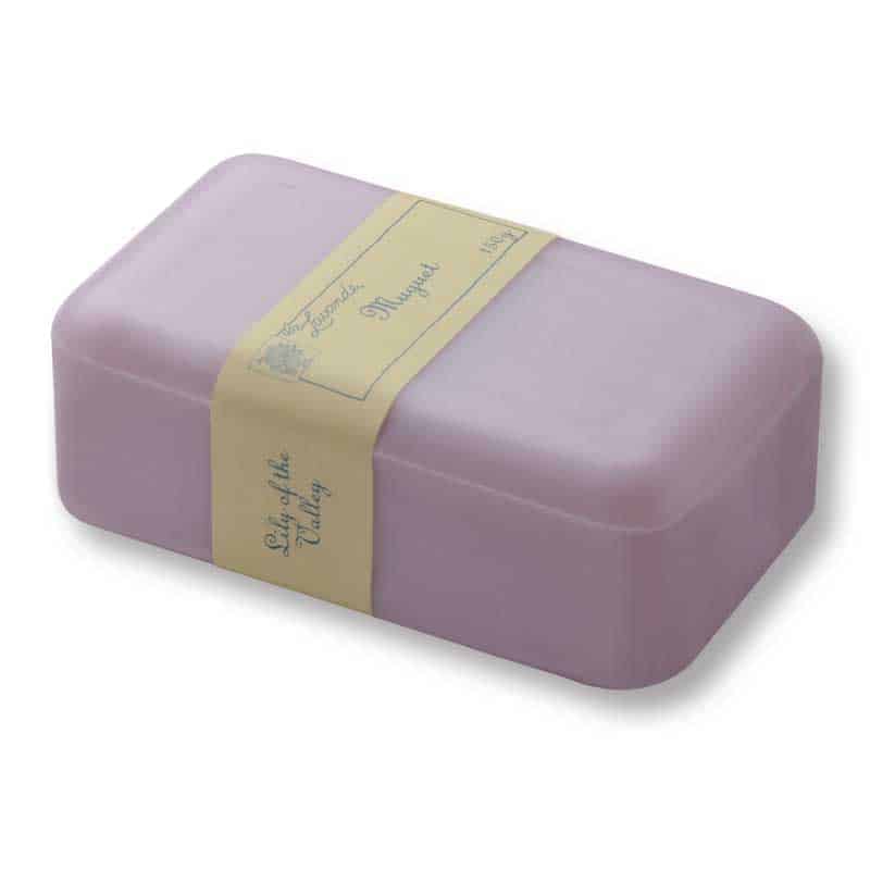 A La Lavande lavender-colored soap bar wrapped in a vintage-style label that reads "Shea Butter" and "Lily of the Valley" in elegant typography, placed on a white background.