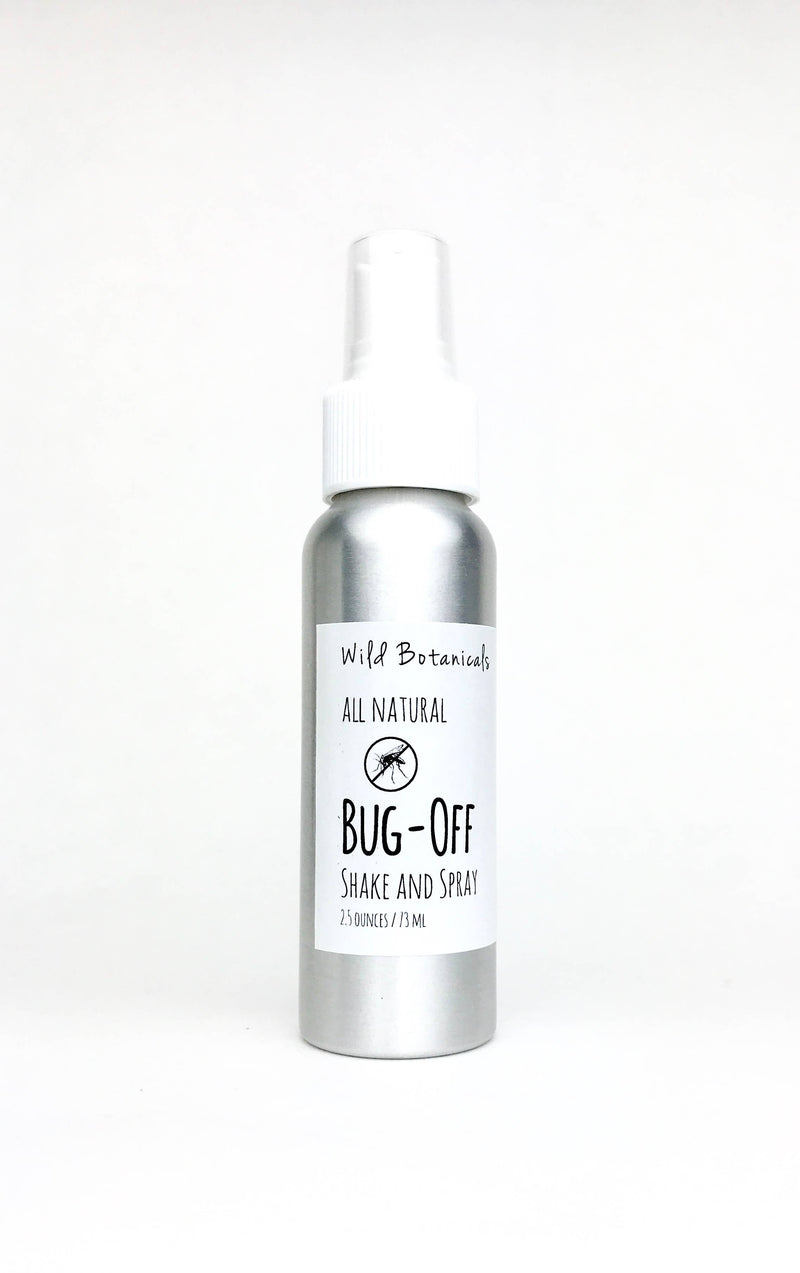 A spray bottle of "Wild Botanicals - 2.5oz Bug Off Shake and Spray" against a white background, label visible with text and leaf logo, containing 2.5 ounces of liquid.