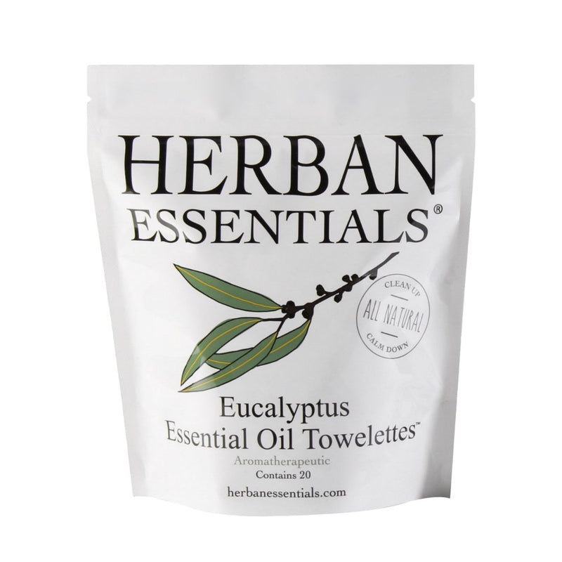 A package of Herban Essentials Essential Oil Towelettes - Eucalyptus doubles as insect repellent. The white pouch features a green eucalyptus branch graphic and text noting it's all natural.