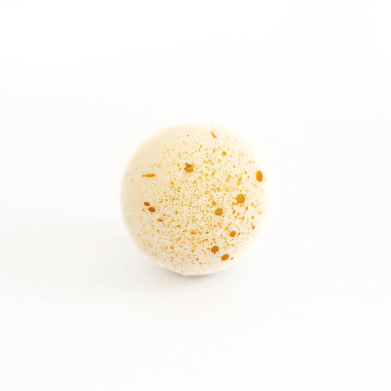 A single SOAK Bath Co. - Coffee Bean Bath Bomb centered on a plain white background, reminiscent of a cozy Sunday morning.
