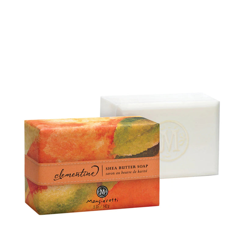 A bar of Mangiacotti Clementine Shea Butter Bar Soap in colorful packaging, next to its white box branded with a pale 'm' logo.