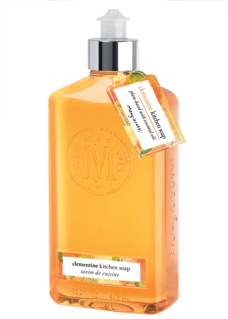 A transparent bottle of Mangiacotti Clementine Kitchen Soap with an orange liquid inside. The bottle features an embossed emblem and a label describing the product. A pump dispenser is attached on top.