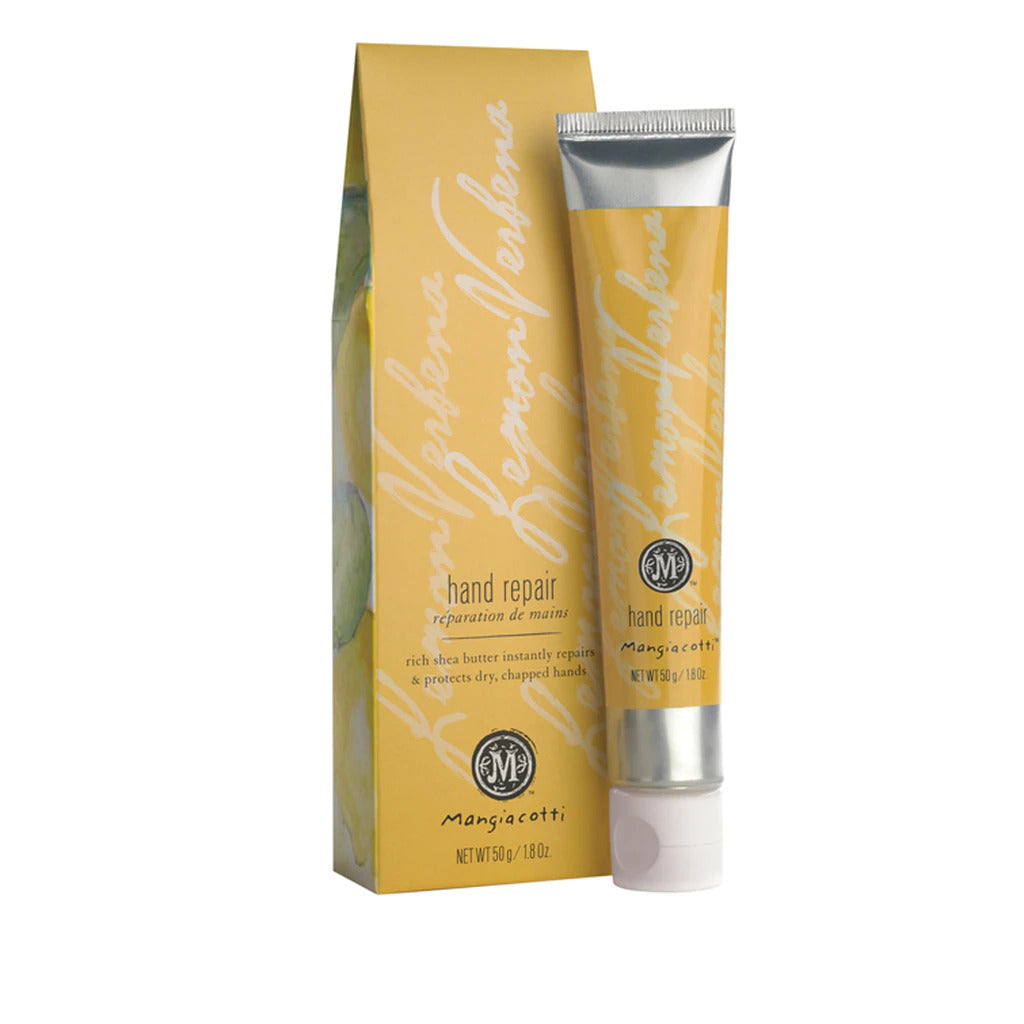 A tube of Mangiacotti Lemon Verbena Hand Repair cream beside its yellow packaging box, both labeled with "mango & catti superb repairing power," focusing on the cream’s beneficial properties for dry hands, enhanced with shea