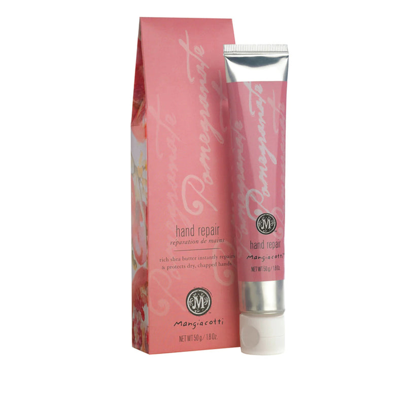 A pink and white decorated tube of Mangiacotti Pomegranate Hand Repair next to its matching box, which features floral designs and elegant script text.