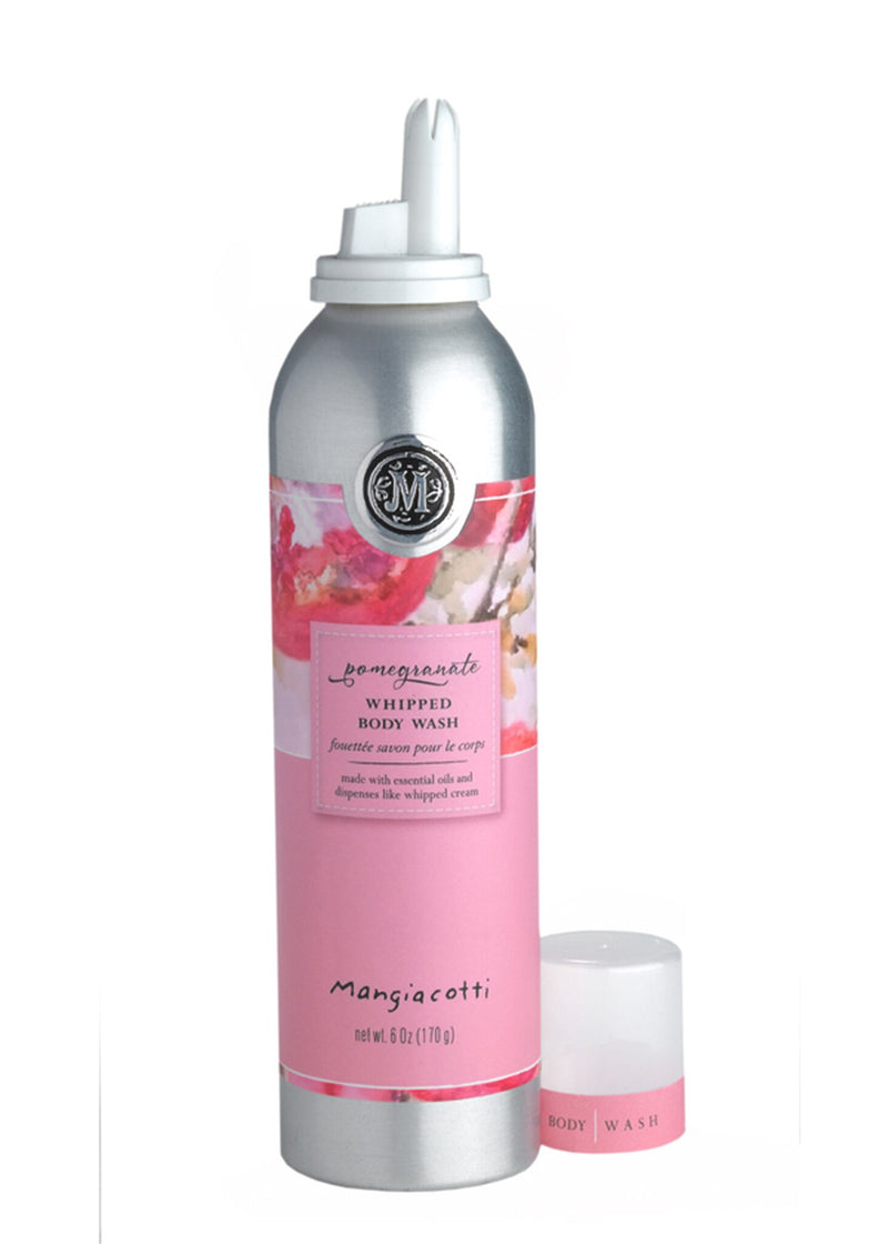 A Mangiacotti Pomegranate Whipped Body Wash canister in silver and pink design next to its matching small white lid, featuring floral elements and text describing the product.