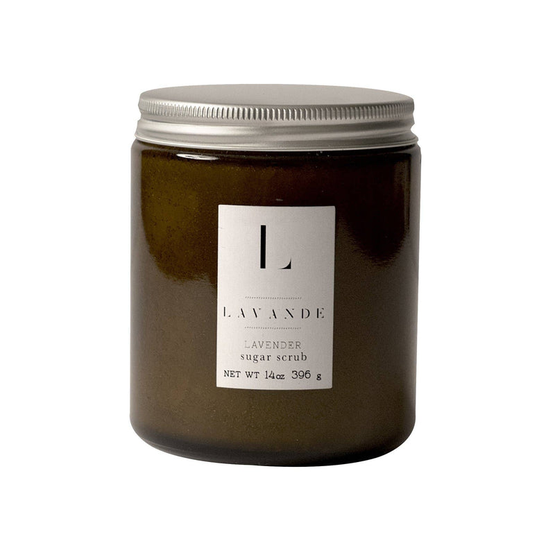 A Lavande glass jar with a silver lid, filled with Lavande lavender sugar scrub made from pure cane sugar. The label on the jar features a minimalistic design with the word "lavande" prominently displayed.