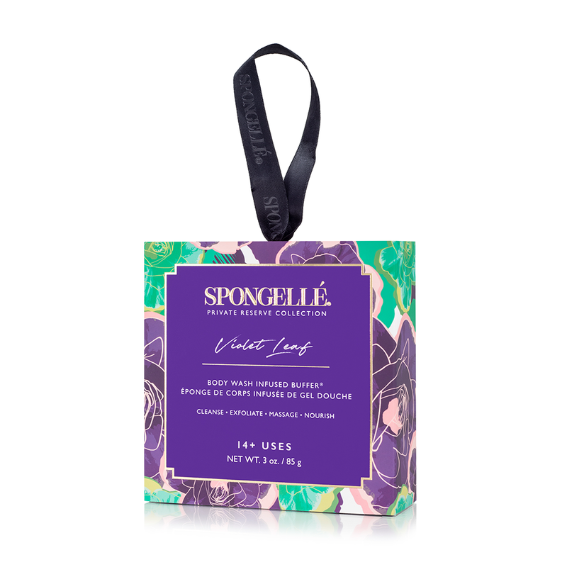 A packaged Spongellé Violet Leaf Boxed Flower body wash infused buffer from the private reserve collection, featuring a colorful floral design on the packaging, a black hanging ribbon, and patented technology.