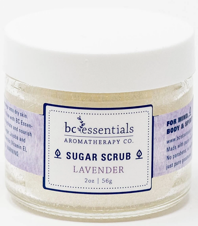 A jar of BC Essentials-Lavender Sugar Scrub - 2oz. The label indicates it's suitable for dry skin, contains Vitamin E, and is made without parabens.