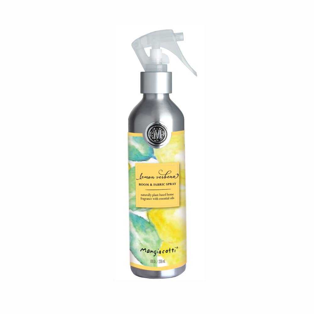 A spray bottle labeled "Mangiacotti - NEW! Lemon Verbena Room & Fabric Spray" with a colorful yellow and green watercolor design, elegant typography, and enhanced with essential oils.