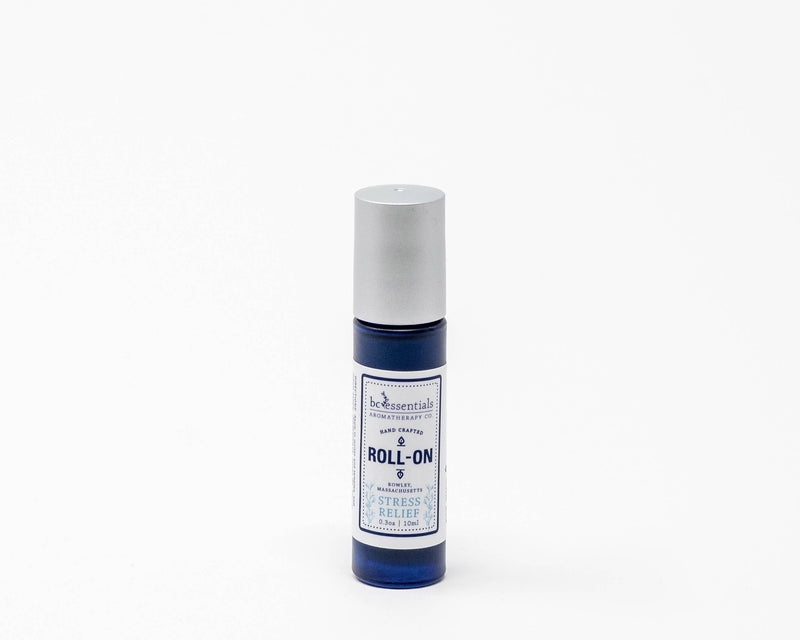 A blue BC Essentials roll-on bottle with a white cap and label that reads "BC Essentials, Stress Relief Roll On" against a clean, white background.