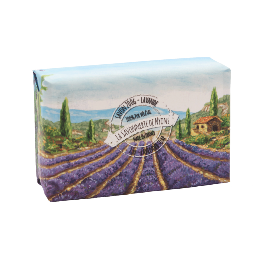 A soap box illustrated with a vibrant lavender field landscape featuring a small house under a clear sky, labeled "La Savonnerie de Nyons" in an elegant font and highlighted as Lavender scented soap