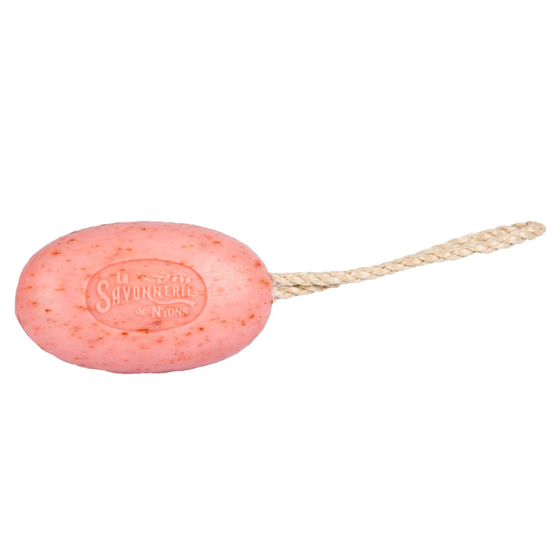A French artisanal "La Savonnerie de Nyons Exfoliating Rose" soap on a rope with the brand's text embossed, positioned against a plain white background.