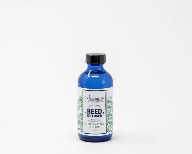 A blue glass bottle labeled "BC Essentials Respiratory Relief Reed Diffuser - 4oz" against a white background.