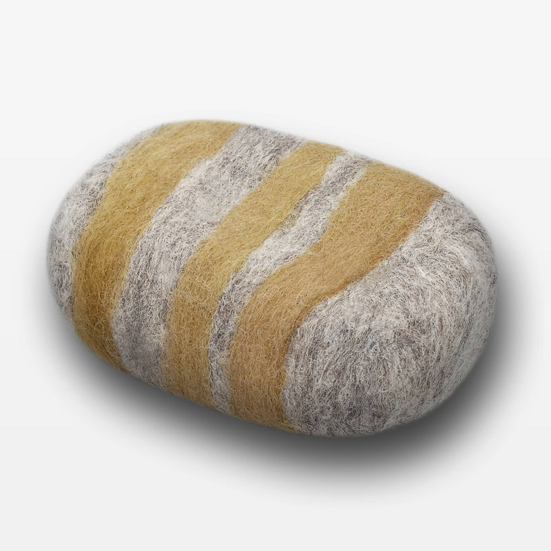 A Fiat Luxe - Striped Lemon Ginger Felted Soap in shades of gray and mustard on a white background, crafted to resemble a real stone but made from felted wool.
