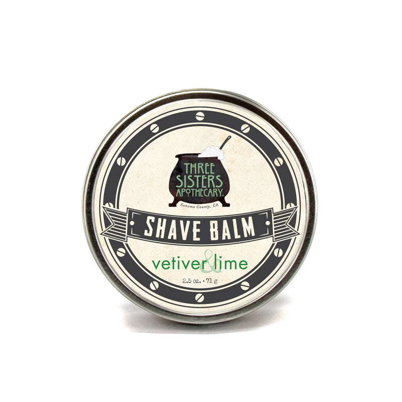 A round tin of Three Sisters Apothecary Shave Balm - Vetiver & Lime, against a white background. The container is silver with vintage-style black and white labeling.