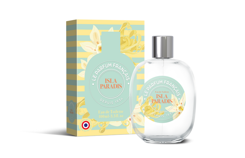 A clear perfume bottle labeled "Le Parfum Français Isla Paradis Eau de Toilette" next to its matching teal and gold packaging box adorned with floral designs, both featuring French text.