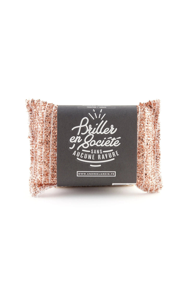 A sparkly copper-colored Andrée Jardin Copper Sponge with a black label featuring white text in French, isolated on a white background.