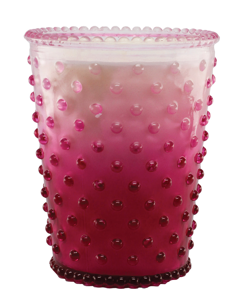 A translucent pink Simpatico NO. 61 Limited Edition Berry Wine Hobnail Glass Candle with a textured surface featuring raised dots, isolated on a white background.