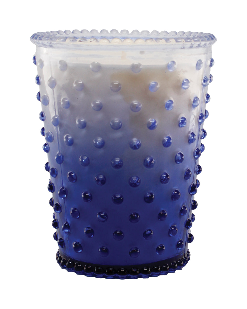 A Simpatico NO. 63 Limited Edition Patchouli Violet Hobnail Glass Candle with a textured, bubble design and a white soy and vegetable wax blend candle inside, isolated on a white background.