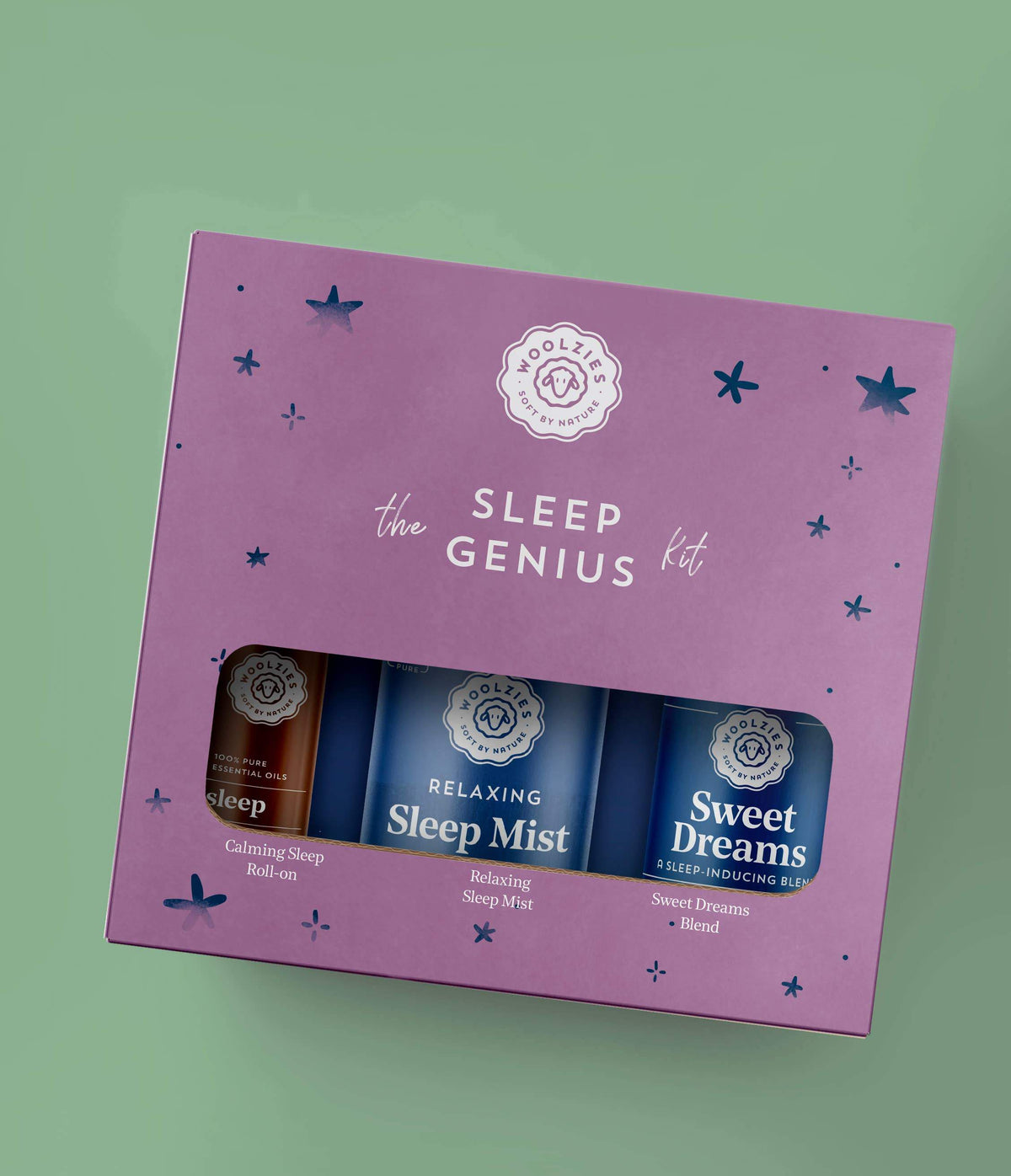 A purple "Woolzies The Sleep Genius Kit" box with three products: calming sleep roll-on, relaxing sleep mist, and sweet dreams sleep inhaler, all infused with stress-relieving essential oils; set against